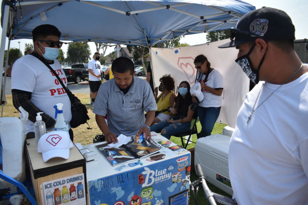 Community buys out inventory from deaf Long Beach street vendor left jobless during pandemic