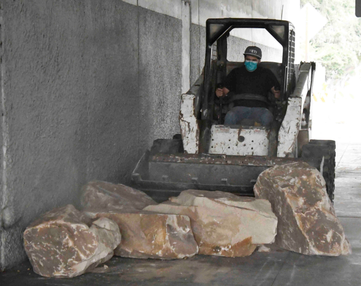 Boulders placed in LA neighborhood’s freeway corridor fuel feud over plight of homeless