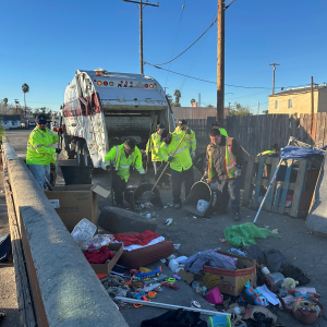 A crew clears an encampment from an alley near Baseline and D streets.