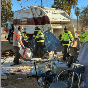 A municipal crew clears an encampment from Meadowbrook Park.