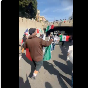 Protesters against the Trump administration's immigration policies march through downtown LA on Feb. 3, 2025.