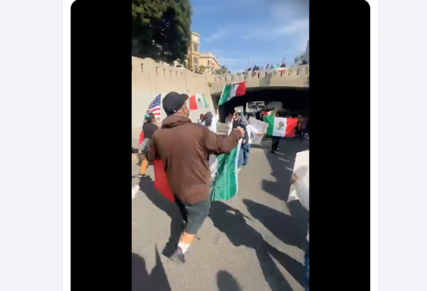 Protesters against the Trump administration's immigration policies march through downtown LA on Feb. 3, 2025.