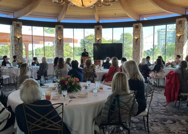 Attendees listen to a presentation during the Impact Las Vegas event.